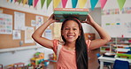 Balance, books and face of girl child in school classroom for development, growth or learning. Future, knowledge and smile with happy student in academy for elementary study or youth scholarship
