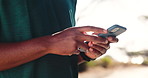 Fitness, phone and hands of person in nature for mobile app to track training, exercise and workout. Sports, typing and athlete on smartphone for wellness, health and chat online on social media