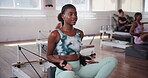 Machine, reformer and fitness with woman in class for pilates workout, health and balance. Exercise, wellness and core strength with people in yoga studio for resistance, self care and flexibility