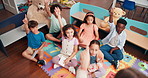Education, answer and group of children, lesson and teacher with questions in classroom and school. Elementary, students and teaching kids for knowledge, growth and development with quiz or learning