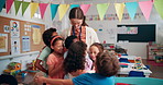 Teacher, happy and hug children in classroom, school and support with growth development at academy. Education, thank you and embrace with kids, students gratitude and love for learning knowledge