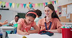 Teacher, child and support with writing in classroom for motivation, advice and books with project. Woman, kid and assessment with guide, notebook and excited for development at learning academy