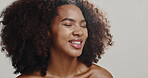 Skincare, spray and glow with woman in studio for beauty, hydration and self care. Cosmetics, smile and dermatology with African person on white background for shine, spa treatment and facial mist