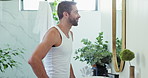Happy, man and mirror with skincare in bathroom of facial results, beauty and wellness benefits. Confident, male person and reflection with dermatology check, natural cosmetics and self care at house