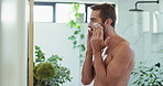 Man, apply and beauty with mirror, cream and skincare with facial hygiene and grooming in morning routine. Anti aging product, reflection or person in bathroom with lotion, sunscreen or moisturizer