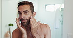 Man, apply and skincare with face, lotion and beauty with facial hygiene or grooming in morning routine. Anti aging product, cosmetics or person in house bathroom with cream, sunscreen or moisturizer