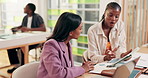 Women, tablet and creative advice with meeting for update, report and explanation on interior designer project. Business people, feedback and discussion or process for employee partnership deadline