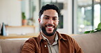 Happy, relax and face of man on sofa in home for weekend, rest and afternoon break. Smile, laughing and portrait of person on couch with confidence, positive attitude and pride in living room