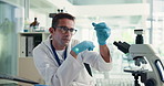 Scientist, test tube and man with chemical for research or cure development on microscope. Chemist, science and doctor with liquid for medical inspection, healthcare innovation or pharma study in lab