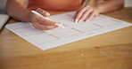 Hands, woman and writing on calendar planner for planning schedule, date reminder and appointment. Female person, annual agenda and to do list of time management, events update and deadline for goals
