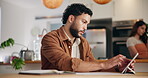 Man, writing and tablet with calendar at house for planning schedule, tasks reminder and appointment. Male person, digital and notebook for annual agenda, time management and publishing deadline date