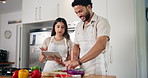 Cooking, tablet and couple with food in kitchen for online recipes for dinner, lunch and meal prep. Home, vegetables and man with woman on digital tech for healthy eating, nutrition and wellness