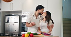 Home, couple and kiss with tablet for cooking, online recipe and bonding together with healthy food. Kitchen, man and woman with hug for support, love and digital tips for vegan salad with vegetables