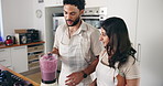 Fruit, blender and couple in kitchen with taste for healthy eating, nutrition and breakfast drink. Home, morning and happy man and woman with berry smoothie for wellness, organic diet and vitamins