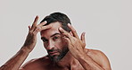 Face, inspection or skincare and shirtless man with white background for daily dermatology routine. Beauty, facial and hygiene with person checking pores in studio for grooming or natural cosmetics