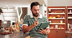 Business, man and counting on tablet in cafe for inventory management, sales tracking and stock checklist. Hospitality industry, owner and digital app in coffee shop for online system and planning