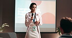 Business, development and presentation with public speaker woman in conference room for training. Education, forum speech and microphone with corporate coach on stage for seminar in office auditorium