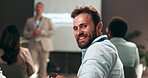 Face, happy and man in seminar, group and training of interns in business meeting, audience or corporate. Conference, people and smile for workshop with team, colleagues and listening to presentation