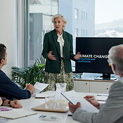 Presentation, climate change and speaker with business people in office ...