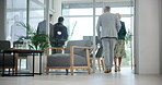 Office, business people and walking to start meeting, planning and corporate workspace. Team arrival, employees and workers at work in boardroom for training, enter workshop or back for collaboration