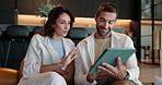 House, tablet and couple on sofa, talking and internet with connection, social media and love. People, apartment and man with woman on couch, tech and digital app for email notifications and network