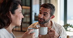 Couple, relax and drink coffee in kitchen with discussion, bonding together and morning breakfast. People, talking and caffeine beverage for weekend break, marriage commitment and wellness at house 