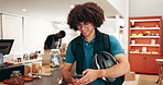 Happy, delivery man and cafe with phone for schedule, transport app or online order at restaurant. Male person, courier guy or smile with mobile smartphone for food or takeaway pickup at coffee shop