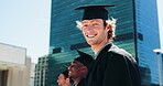 City, education and graduation with face of student boy outdoor for college or university ceremony. Buildings, certificate and qualification with confident graduate downtown for scholarship success