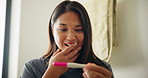 Home, woman and happy with shock for pregnancy test, good news or fertility in bathroom. Excited, female person or surprised expression with kit for positive results, ivf success or pregnant in house