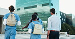 Back, city and medical students walking with professor for conversation, development or education. Commute, healthcare and medicine with group of people downtown for travel to clinic or hospital