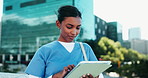 Reading, doctor and student with tablet in city studying for clinical exam or test. Education, digital technology and female healthcare intern with online textbook in town for university scholarship.