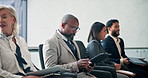 Business, man and row on tablet in interview for hiring, b2b preparation and human resources. People, digital and application form for recruitment process, resume and job opportunity in waiting room
