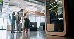 Collaboration, conversation and meeting with business people in lobby of office for planning. Discussion, management and teamwork with employee group in lobby for development, feedback or review
