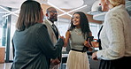 Collaboration, handshake and meeting with business people in lobby of office for greeting or welcome. Conversation, discussion and teamwork with corporate employee group shaking hands in workplace