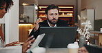 Meeting, cafe and man with laptop, group and plan for project with tech, sales manager or talking. Corporate, colleagues and discussion for collaboration in restaurant, serious and people in business