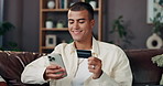 Home, sofa and man with smartphone for credit card, banking app and payment for online shopping. House, couch and male person with mobile for debit details, ecommerce and subscription for platform