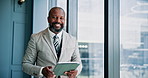 Tablet, communication and mature businessman by window in office with stock market development for investment. Digital technology, portrait and male financial manager with email for finance proposal.