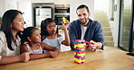 Home, parents and kids with toys for playing, cognitive development and bonding together as family. Kitchen, mother and dad with children for puzzle blocks, game and creativity with support in house