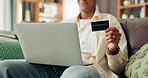 Sofa, man and typing with laptop for credit card, banking web and payment for online shopping. Home, male hands and transaction with digital for debit details, ecommerce and subscription for platform