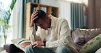 Frustrated man, headache and stress with anxiety on sofa for mistake, financial crisis or job loss at home. Male person, concern or migraine with depression or worry for mental breakdown or debt