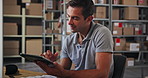 Tablet, cargo and man in warehouse for distribution stock with cardboard boxes on shelf. Digital technology, packages and male delivery coordinator checking online order for ecommerce parcel.