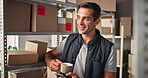 Phone, thinking and man in office for logistics, supply chain and text with coffee. Mobile, ecommerce and happy worker in warehouse on internet for shipping insight, planning or idea for distribution