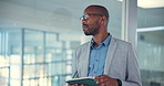 African man, tablet and thinking at office in hallway for research, insight and decision with ethics for journalism. Person, writer and click on application by window, article and info for newsletter