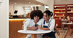 Date, couple and talking with phone in cafe for online post, social media scroll or web research. Gen z people, happy or smartphone in restaurant for streaming service, bonding together or connection
