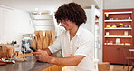 Man, typing message and online in store, business owner and chat to supplier for update. Happy person, communication and website or app to schedule tasks, professional and reading email response