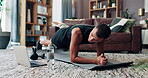 Laptop, fitness and plank with man in living room for streaming workout class, learning and health. Exercise, wellness and training with person and home gym for sports, virtual course and core