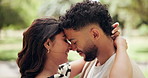 Happy, forehead touch and couple in park for bonding, dating and commitment for outdoor. Nature, love and man and woman embrace for affection, relationship and hug for romance on weekend together