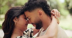 Happy, hug and couple kiss in park for bonding, dating and commitment on weekend. Nature, morning and man and woman embrace for affection, relationship and anniversary for love and romance together
