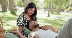 Love, couple and relax at park for picnic, tickle or laughing together on date for chat. Happy man, woman and embrace outdoor for romantic relationship, playful and holding hands with funny partner