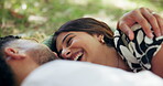 Couple, date and laugh in park with hug, bonding and point with cloud watching. People, embrace and outdoor for relationship development, weekend relax or smile for love and anniversary picnic
